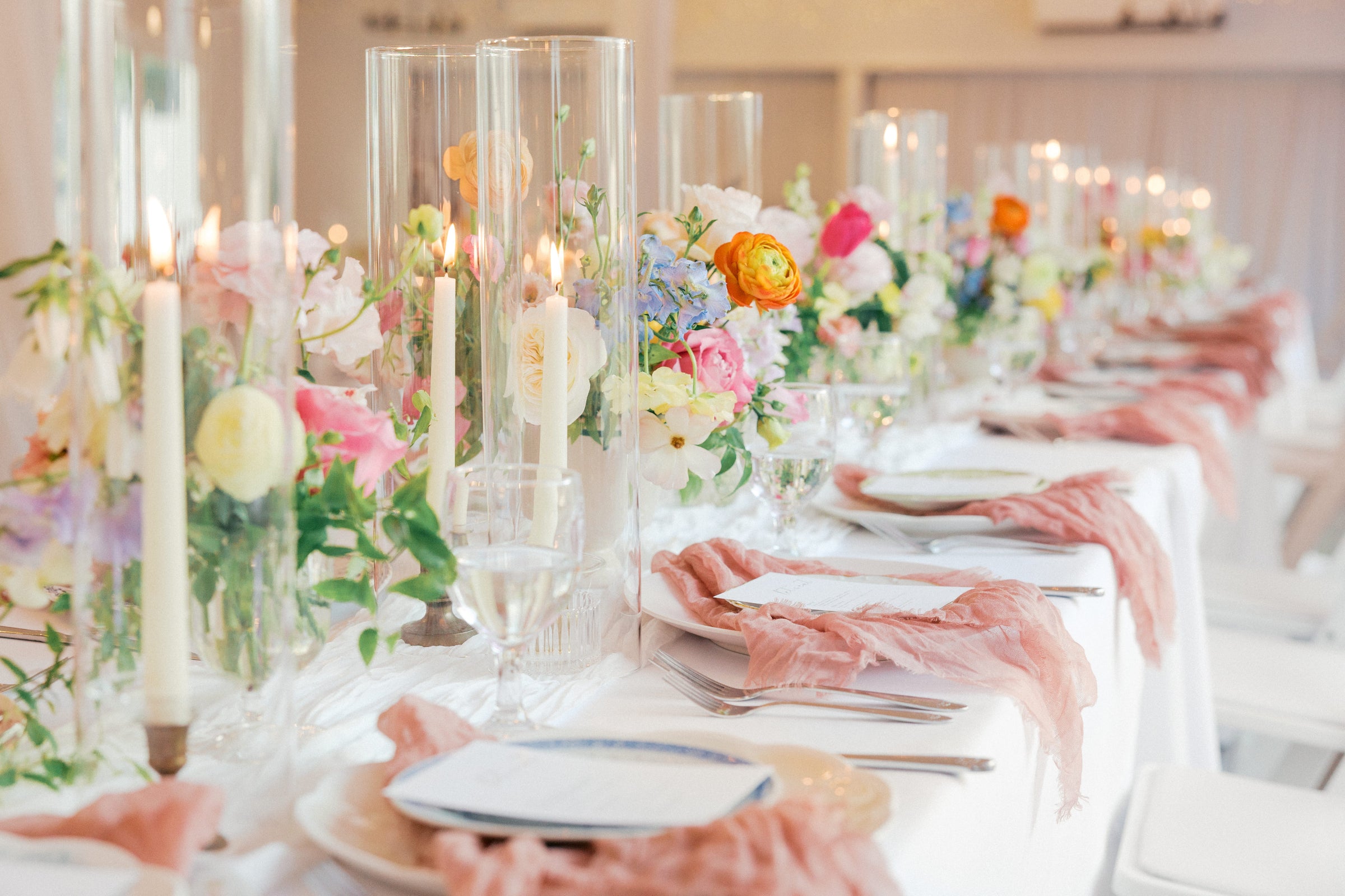 Elegant table setting with floral centerpieces, and candles