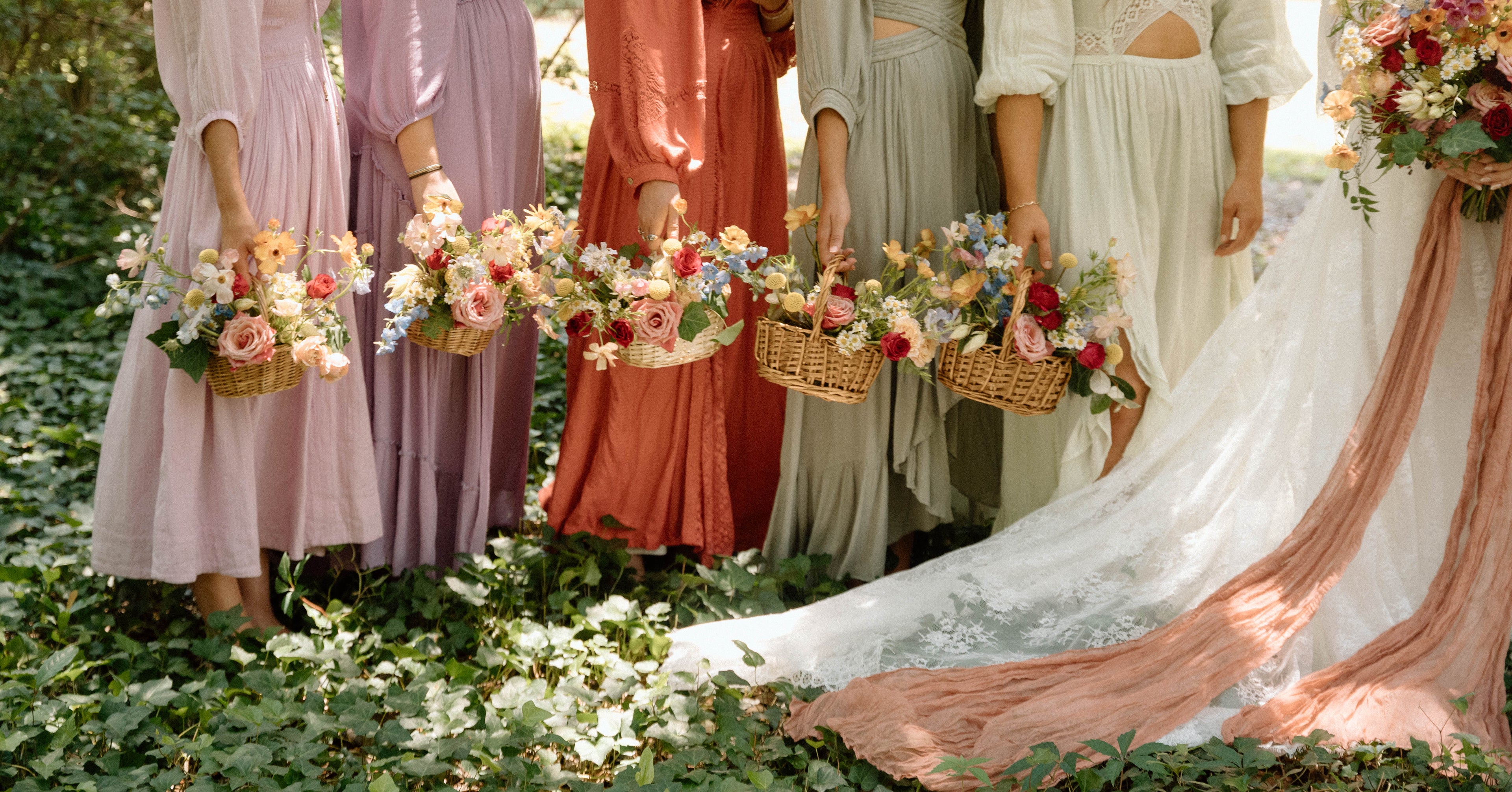 unique bridesmaids bouquets in baskets, colorful